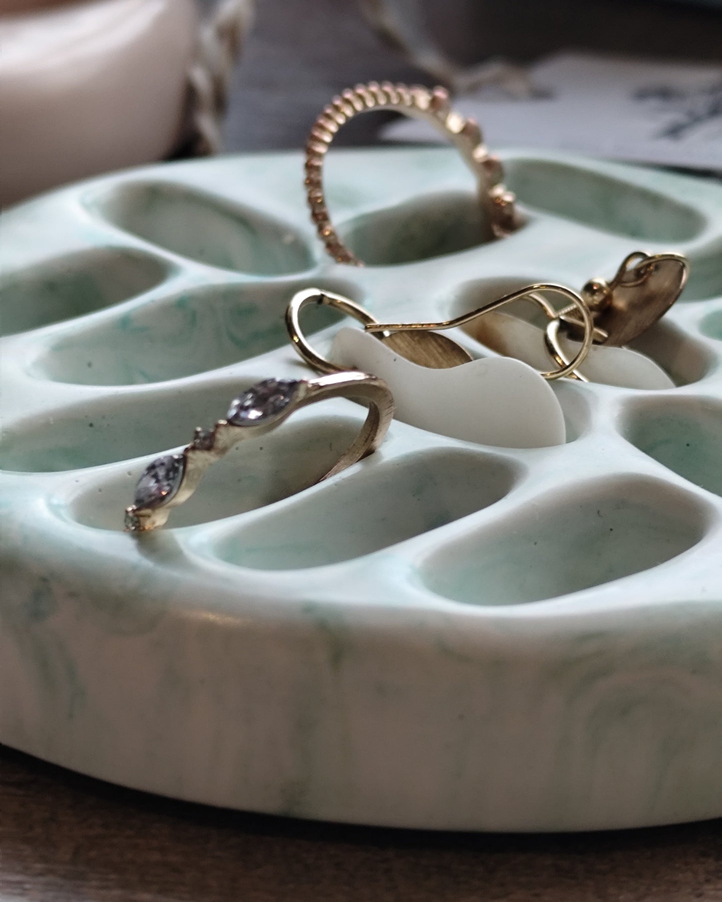 EARRINGIN AND RINGS IN DISH
