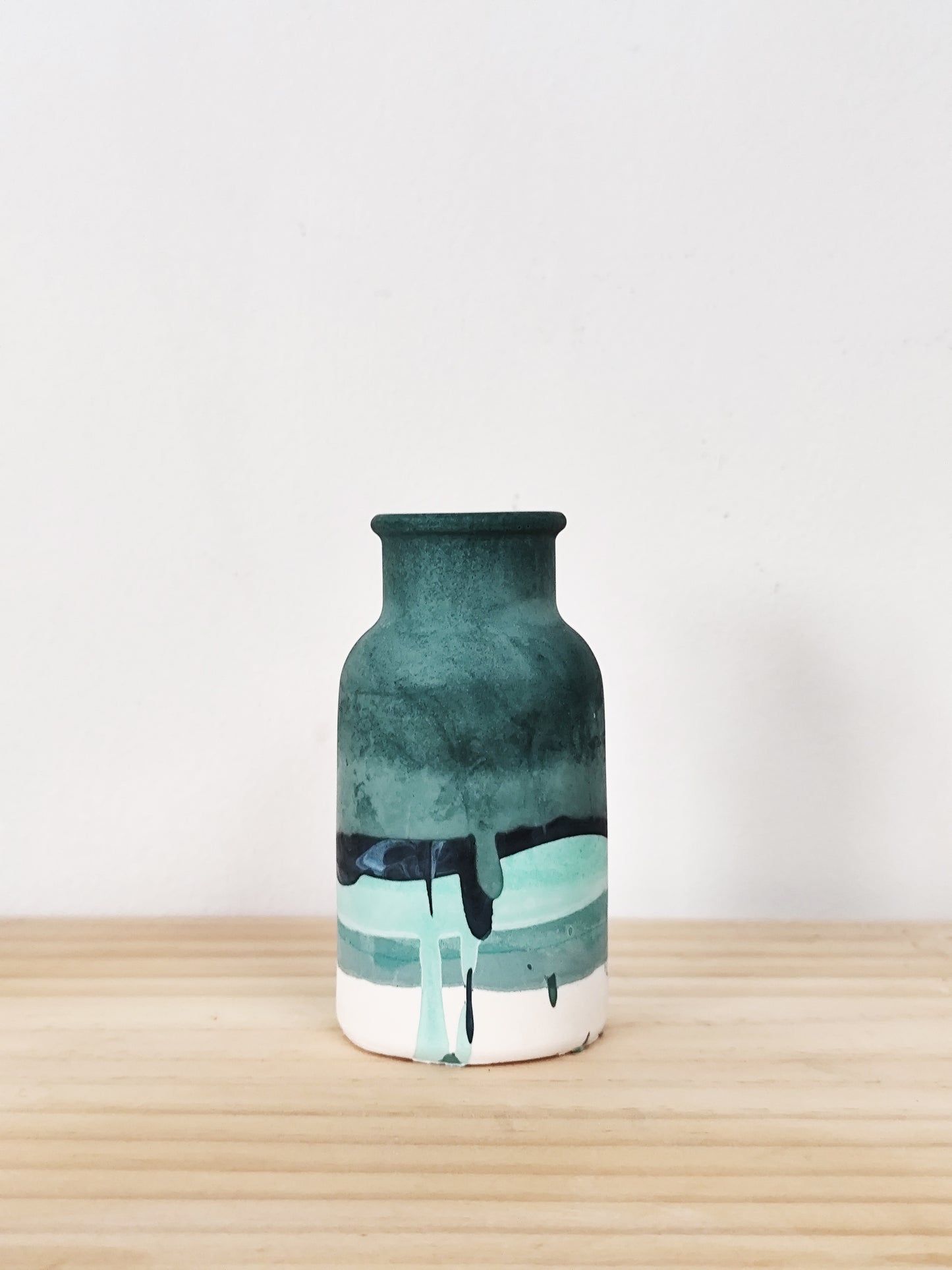 bud vase with differnt tones of green