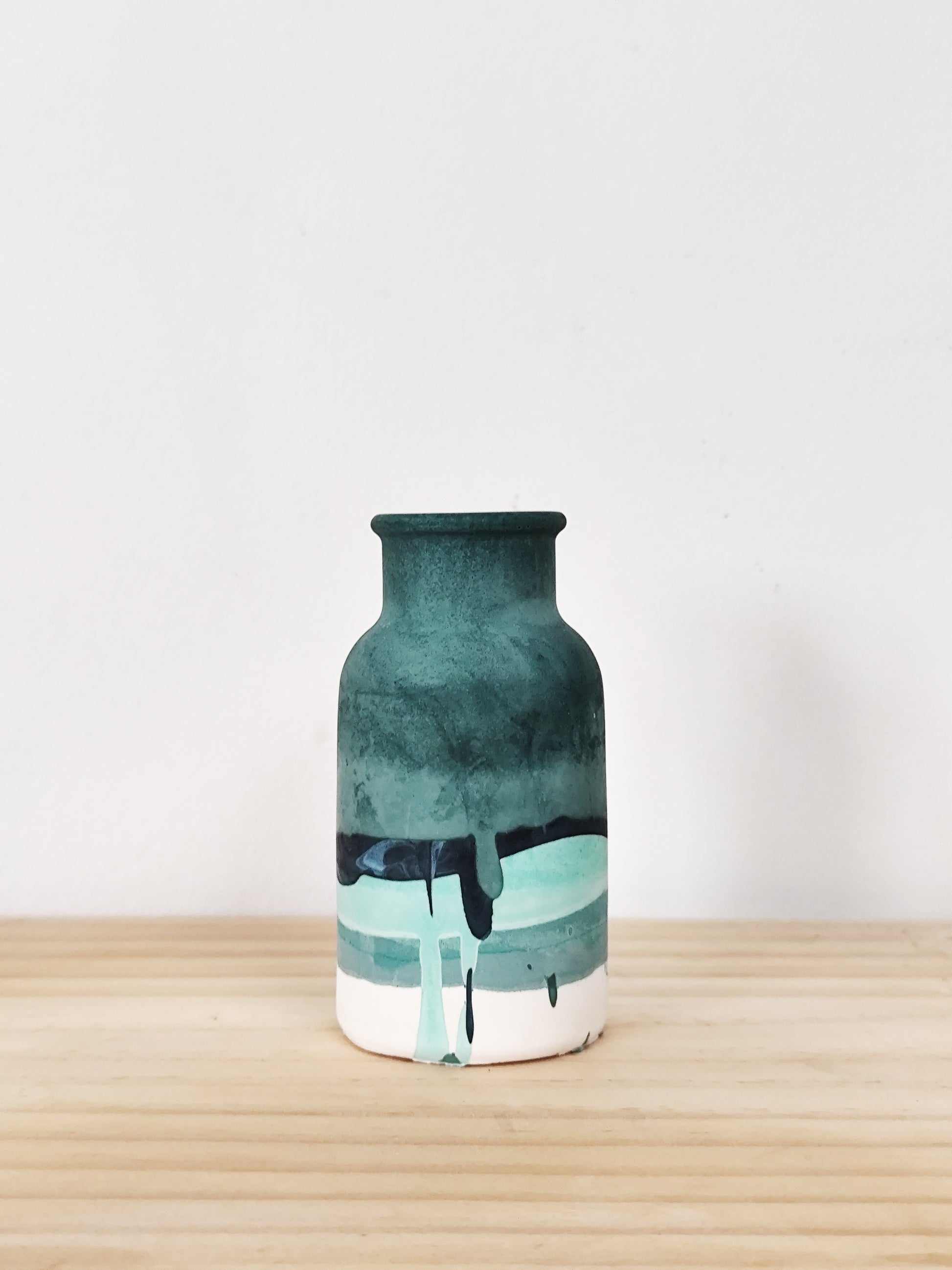 bud vase with differnt tones of green