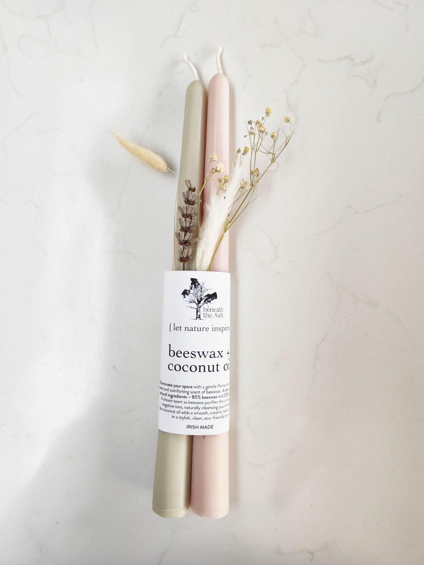 Eco friendly taper candles made from beeswax and coconut oil blend
