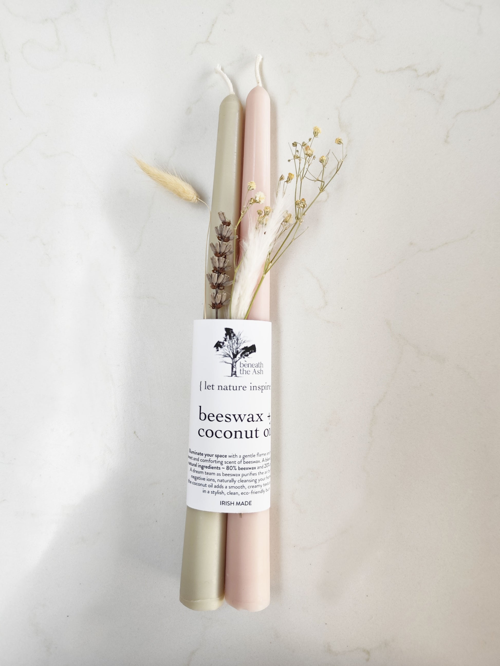 Eco friendly taper candles made from beeswax and coconut oil blend