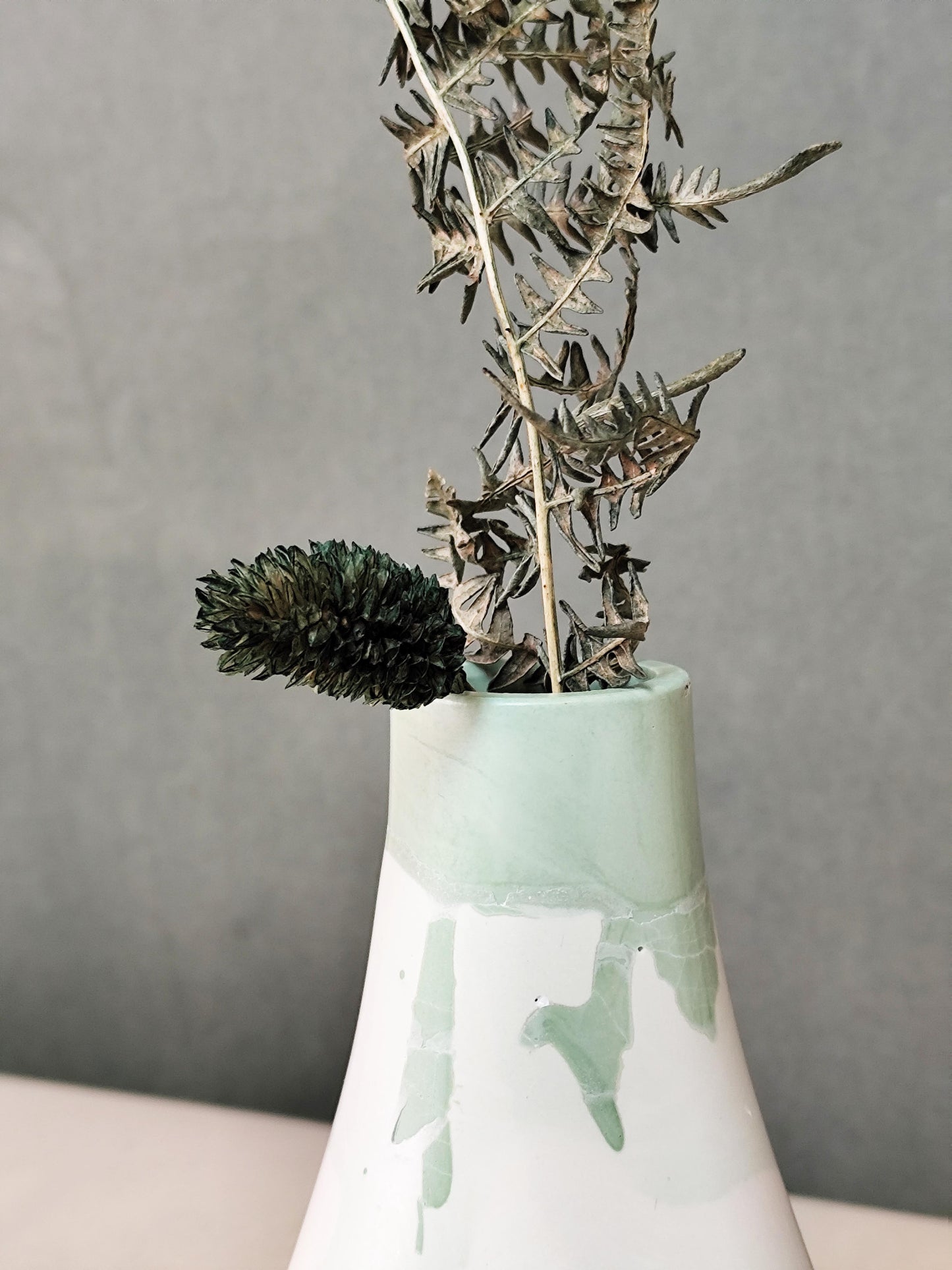Green and white flowing colour transition on the Luna sculptural dried flower vase